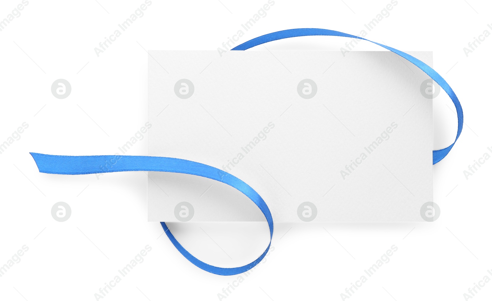 Photo of Blank card and blue ribbon isolated on white, top view