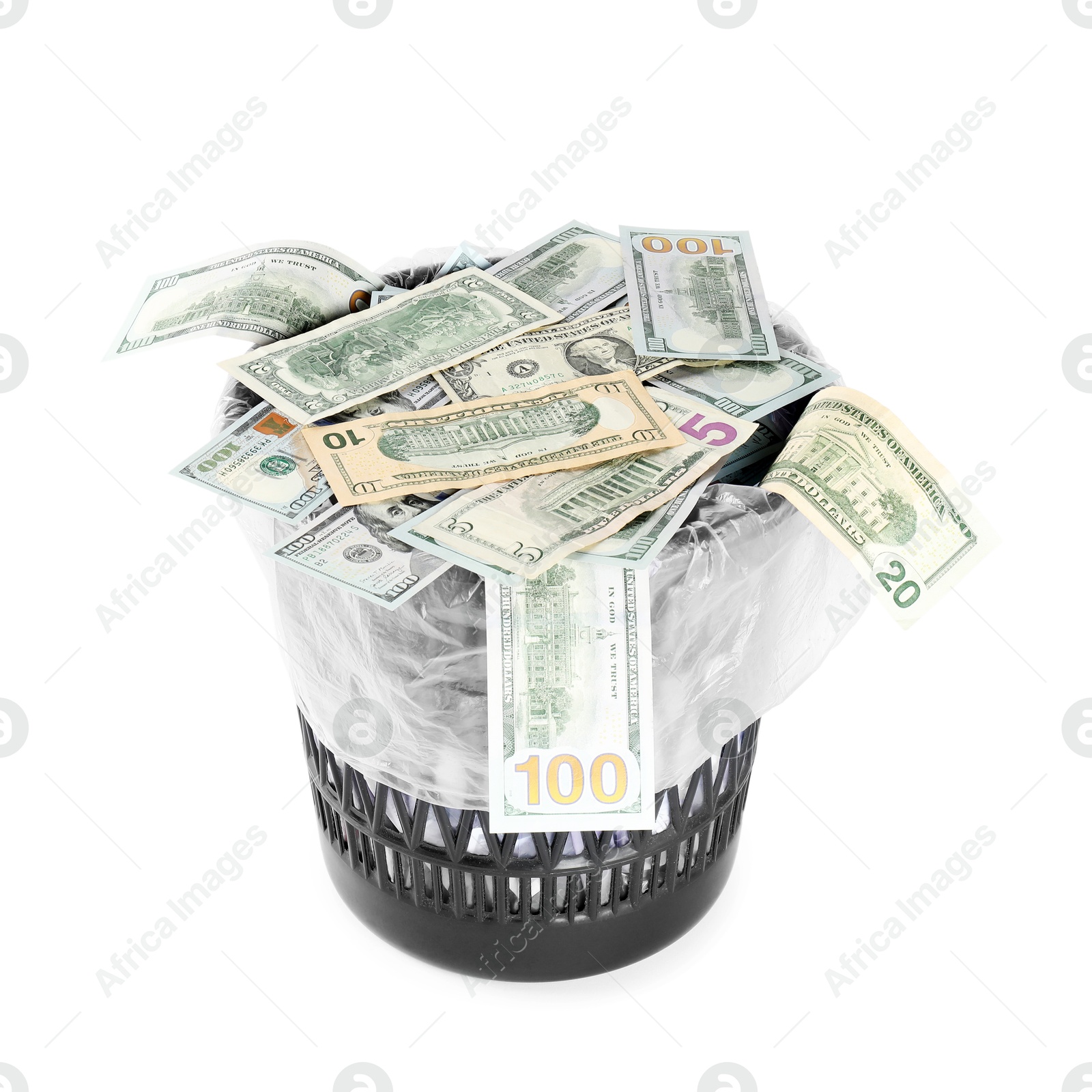 Photo of Many dollar banknotes in trash bin isolated on white