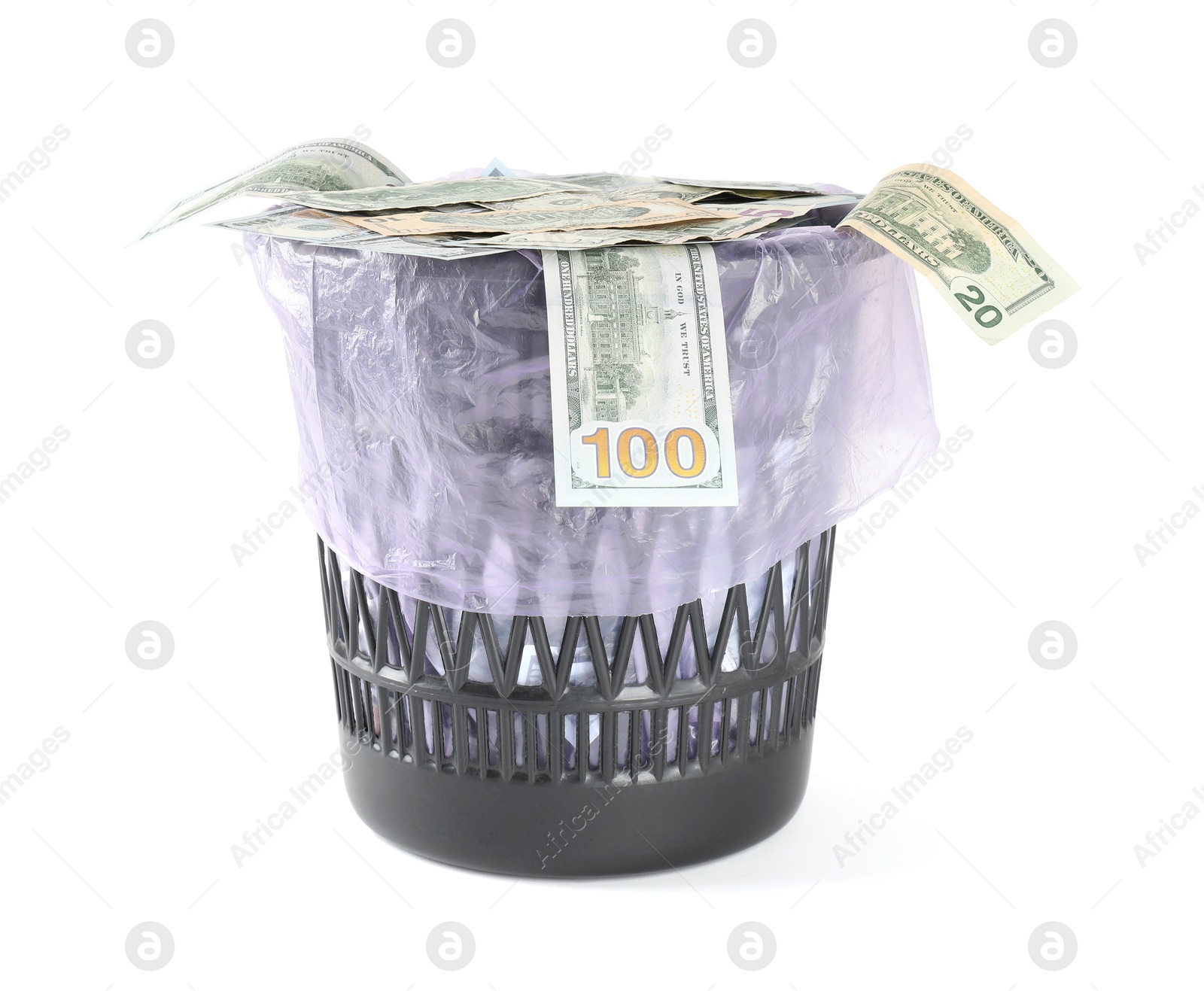 Photo of Many dollar banknotes in trash bin isolated on white