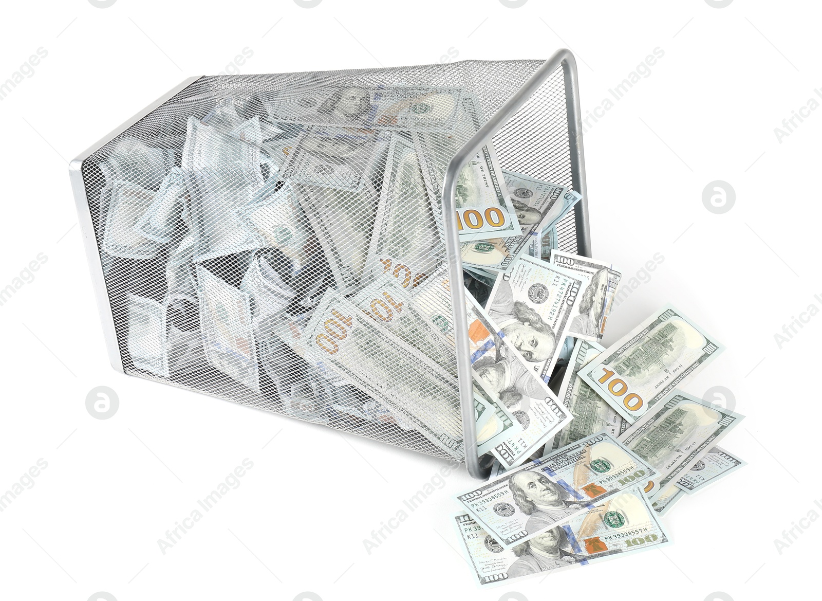 Photo of Many dollar banknotes and overturned trash bin isolated on white