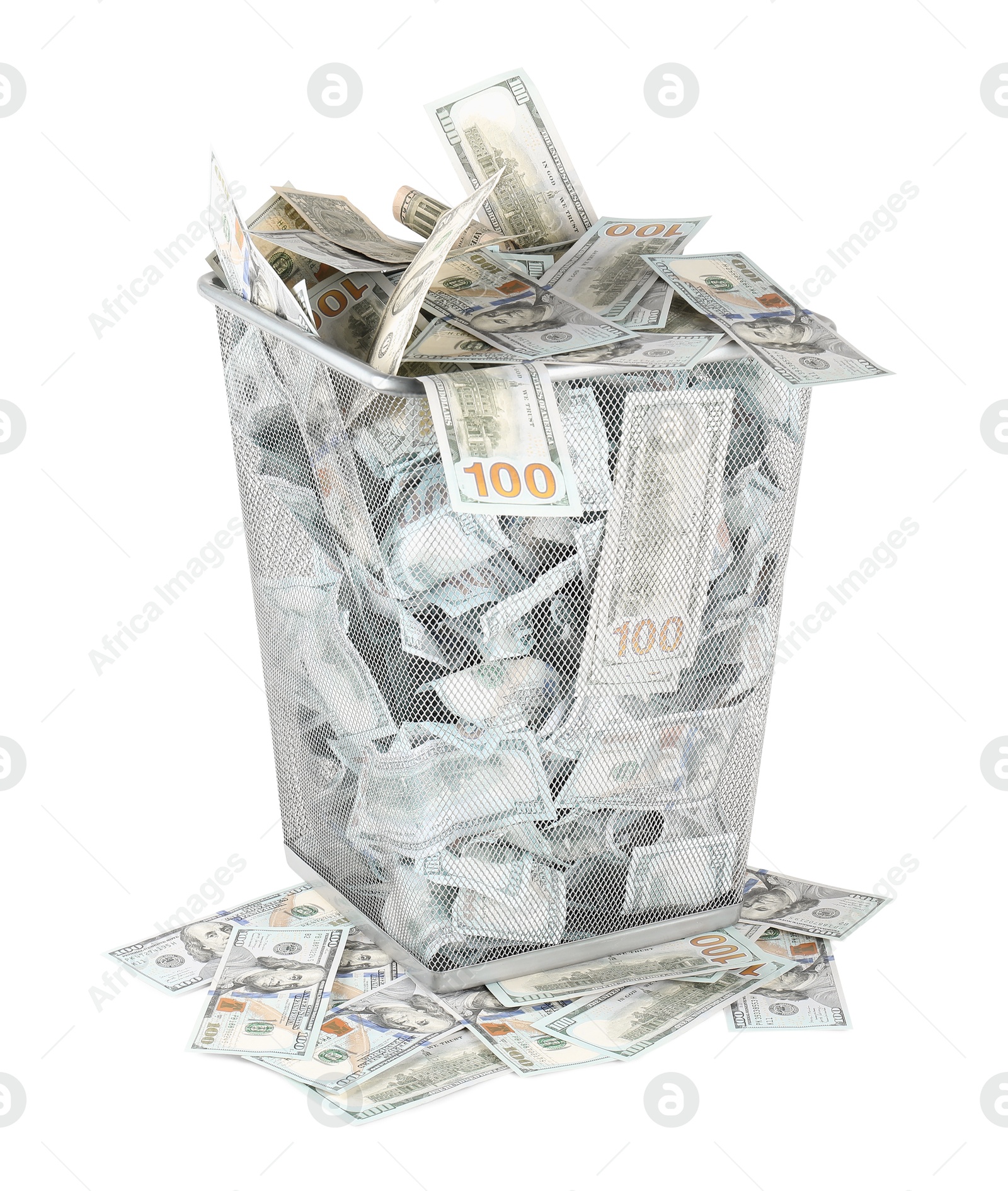 Photo of Many dollar banknotes in trash bin isolated on white