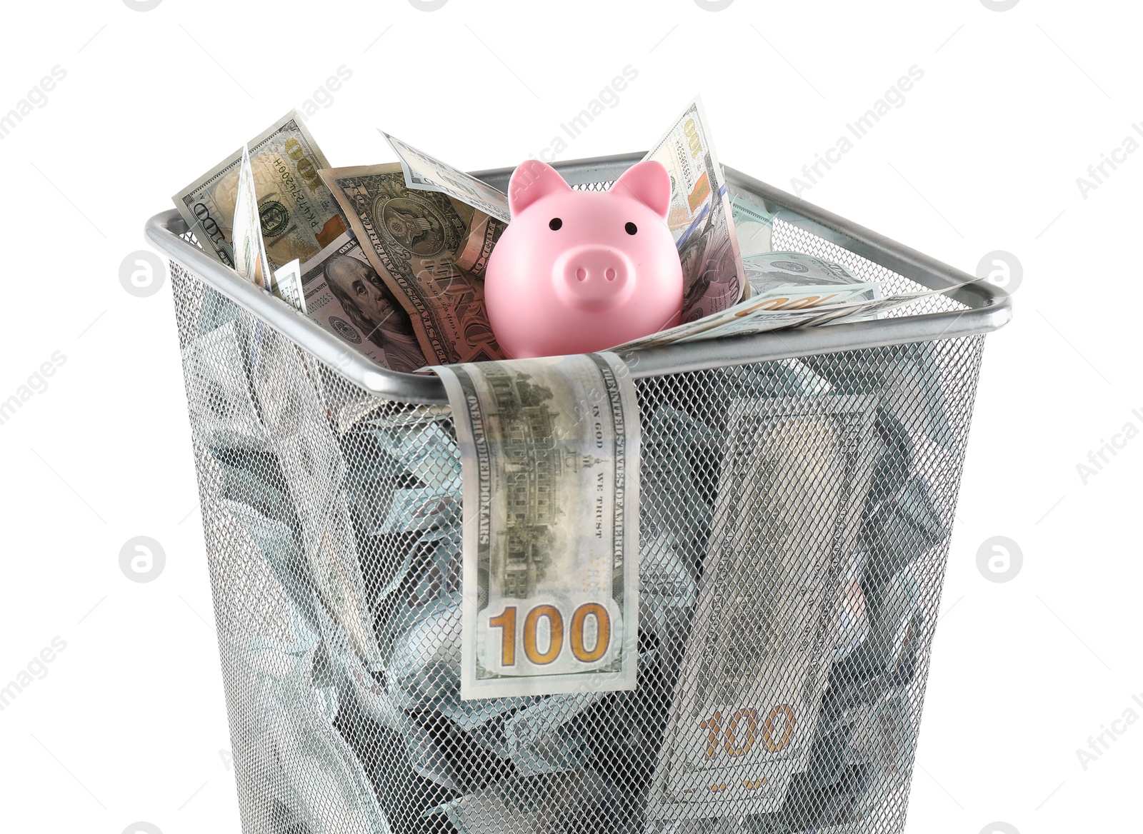 Photo of Many dollar banknotes and piggy bank in trash bin isolated on white