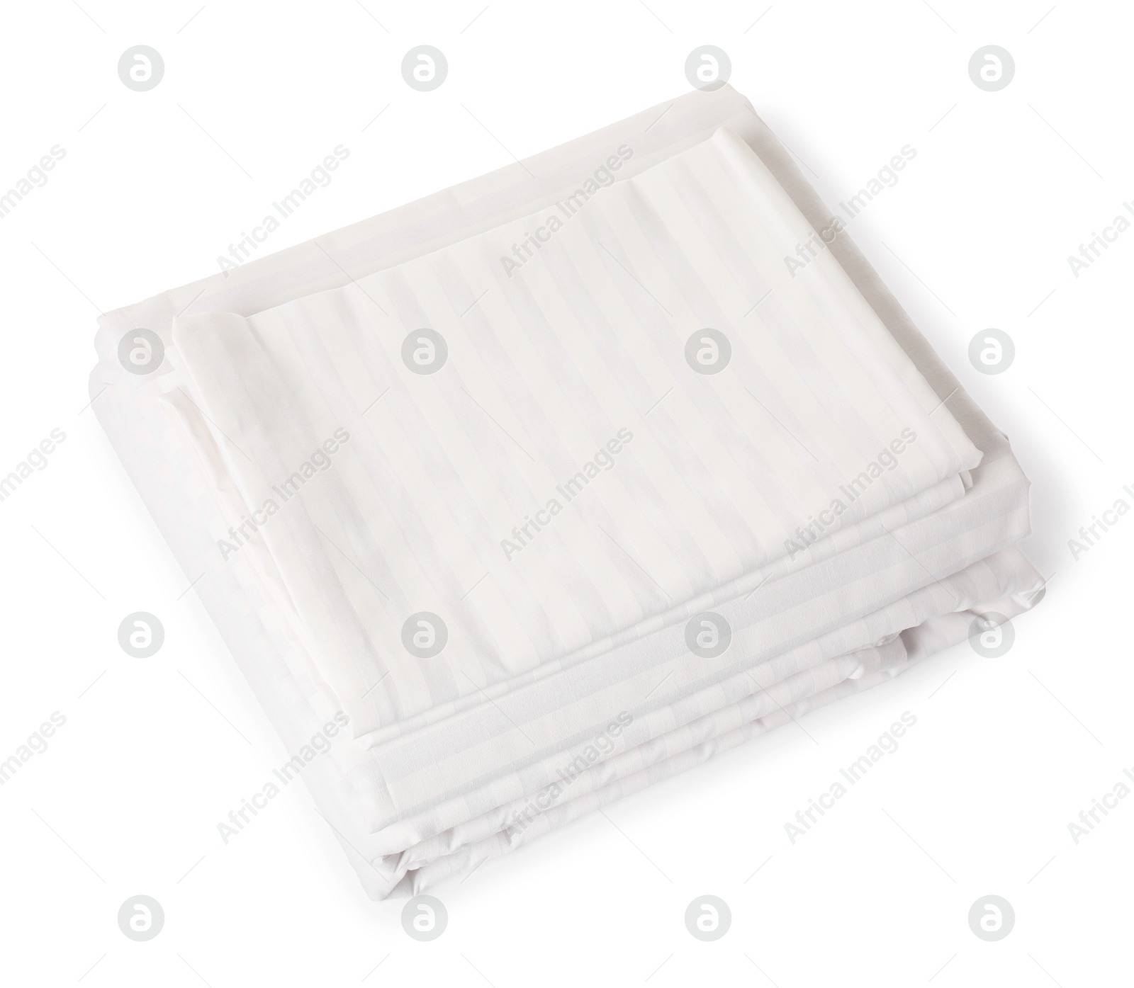 Photo of Stacked clean bed linens on white background