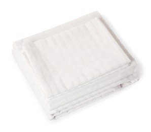 Photo of Stacked clean bed linens on white background