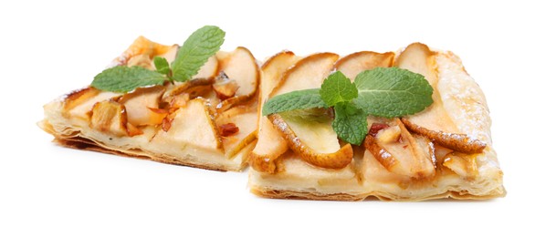 Photo of Pieces of tasty puff pastry pie with pears and mint isolated on white