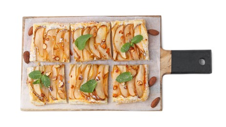 Photo of Pieces of tasty puff pastry pie with pears, mint and almonds isolated on white, top view