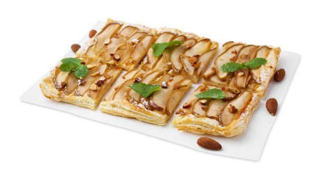 Photo of Pieces of tasty puff pastry pie with pears, mint and almonds isolated on white