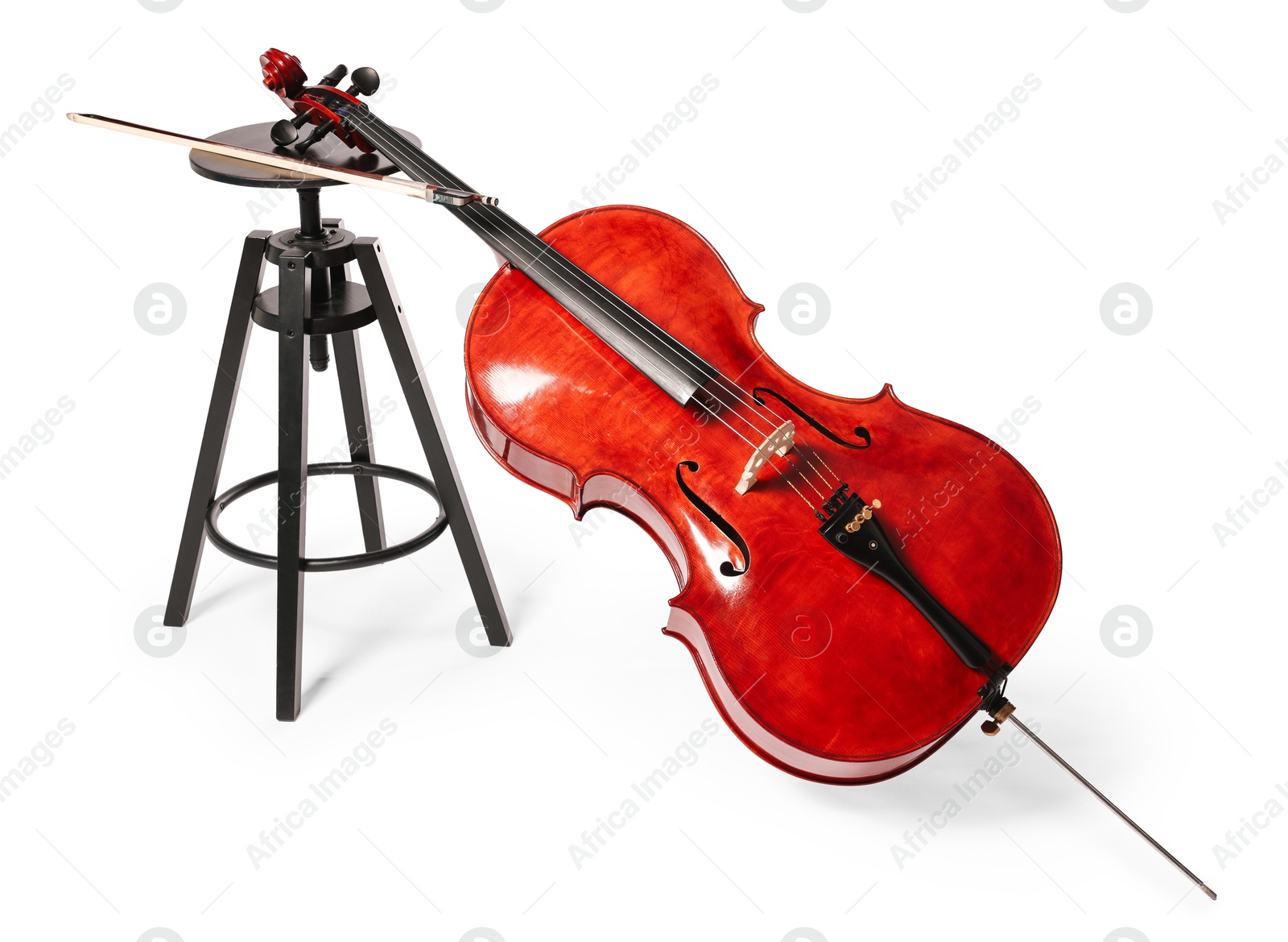 Photo of Beautiful cello and stool isolated on white. Classic musical instrument