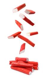 Image of Crab stick pieces falling on white background