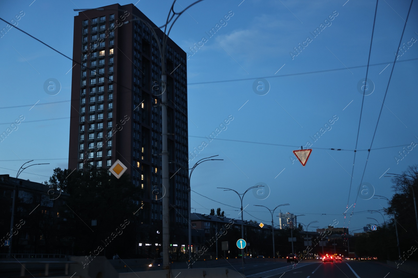 Photo of Cityscape with road traffic and street lights in evening