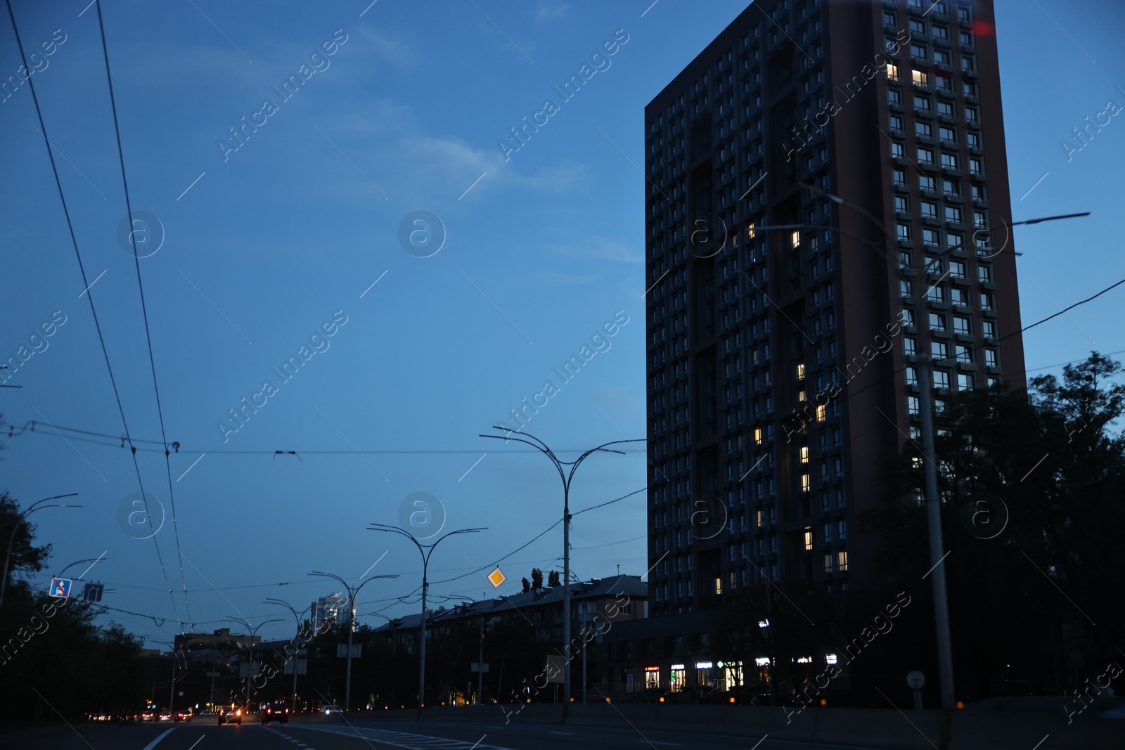 Photo of Cityscape with road traffic and street lights in evening