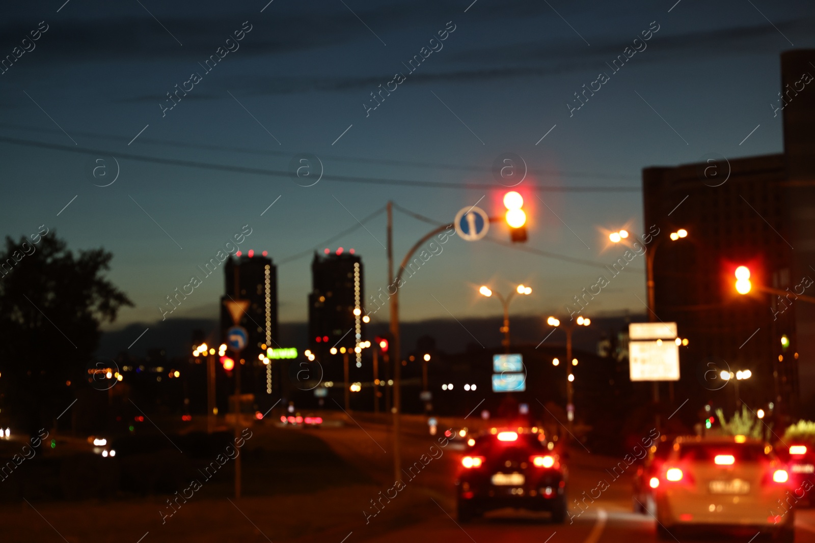 Photo of Cityscape with road traffic and street lights in evening