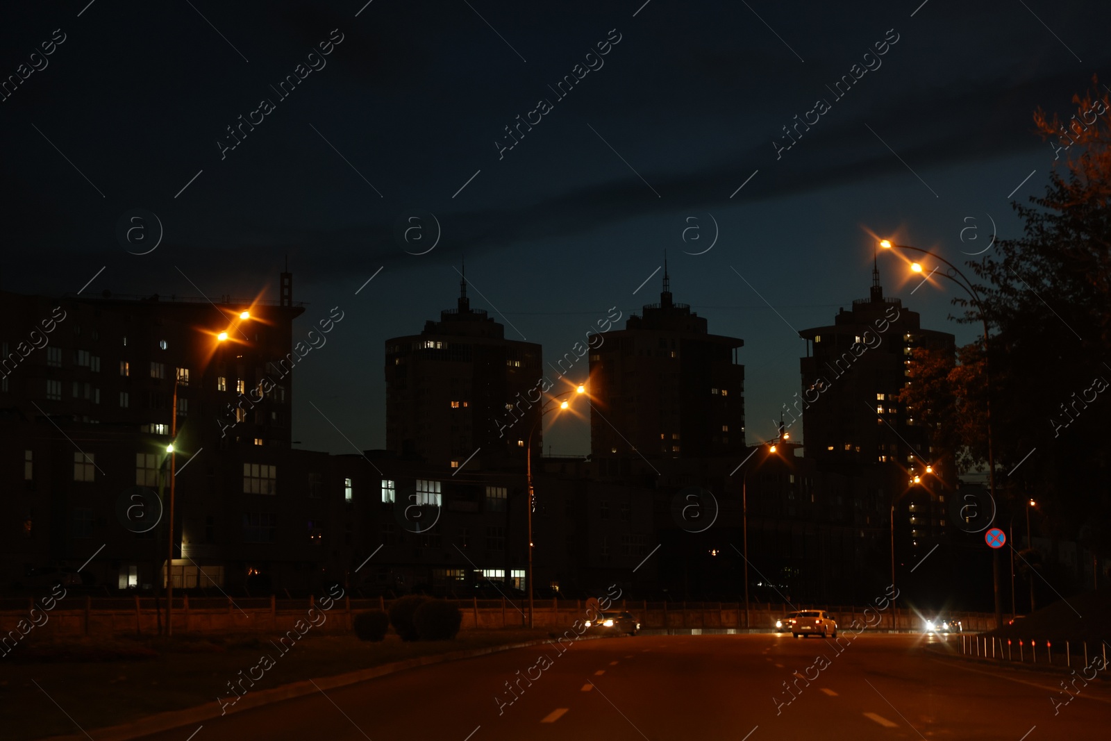 Photo of Cityscape with road traffic and street lights in evening