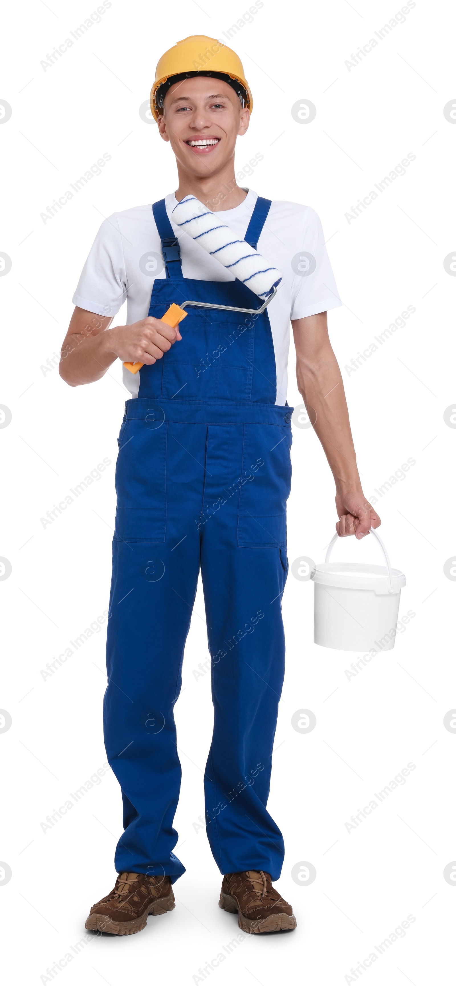 Photo of Young decorator with paint roller and bucket on white background