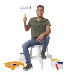 Young decorator with different tools on white background