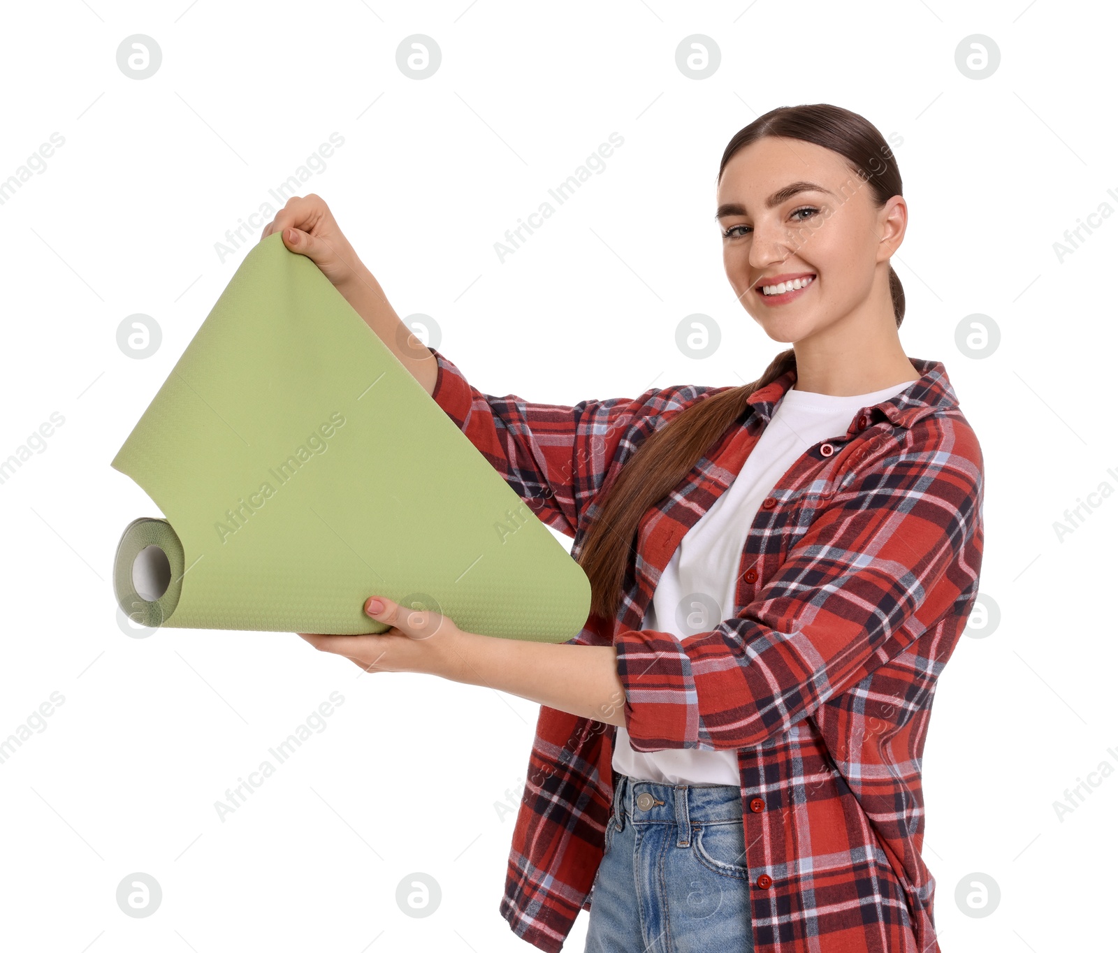 Photo of Young decorator with roll of wallpaper on white background