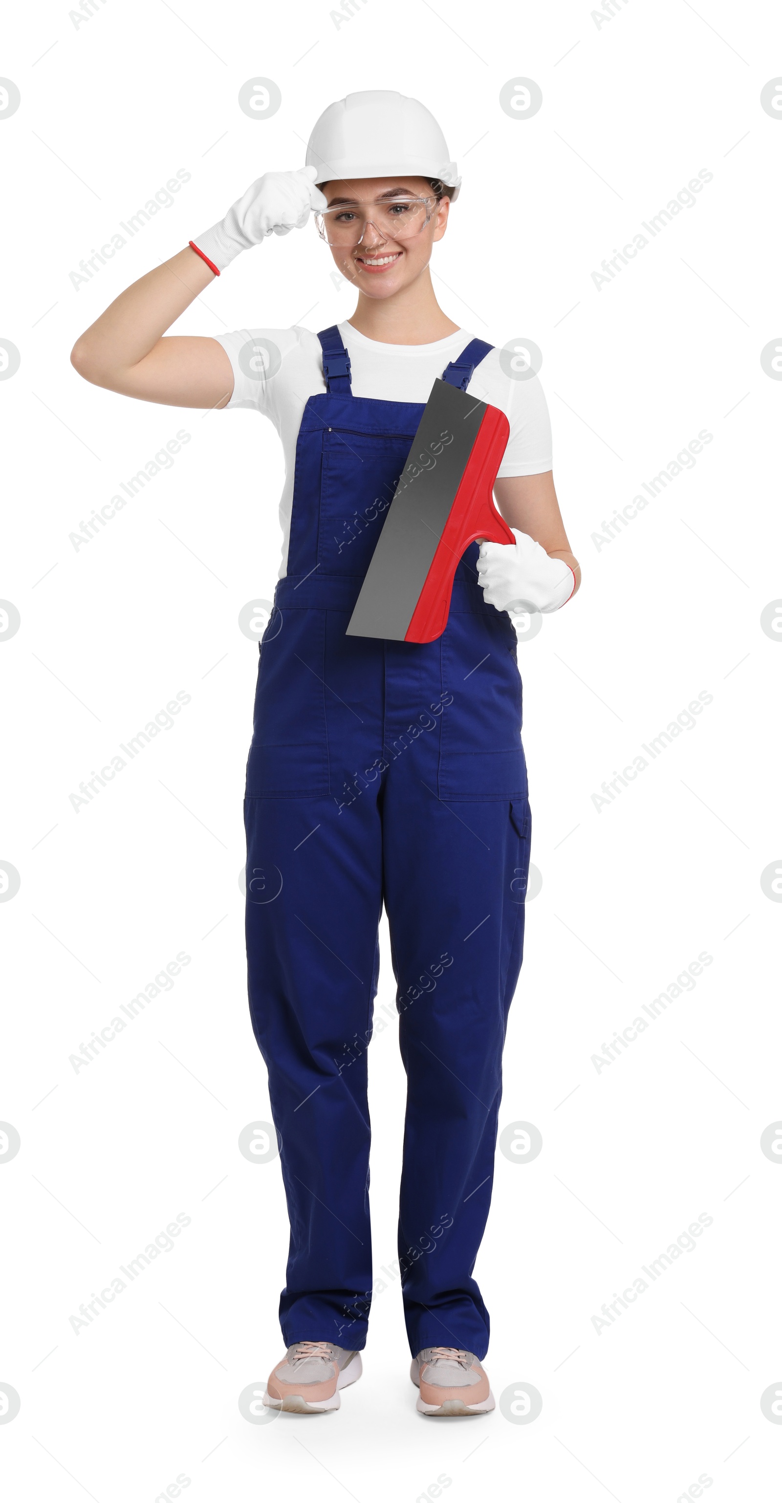 Photo of Young decorator with putty knife on white background