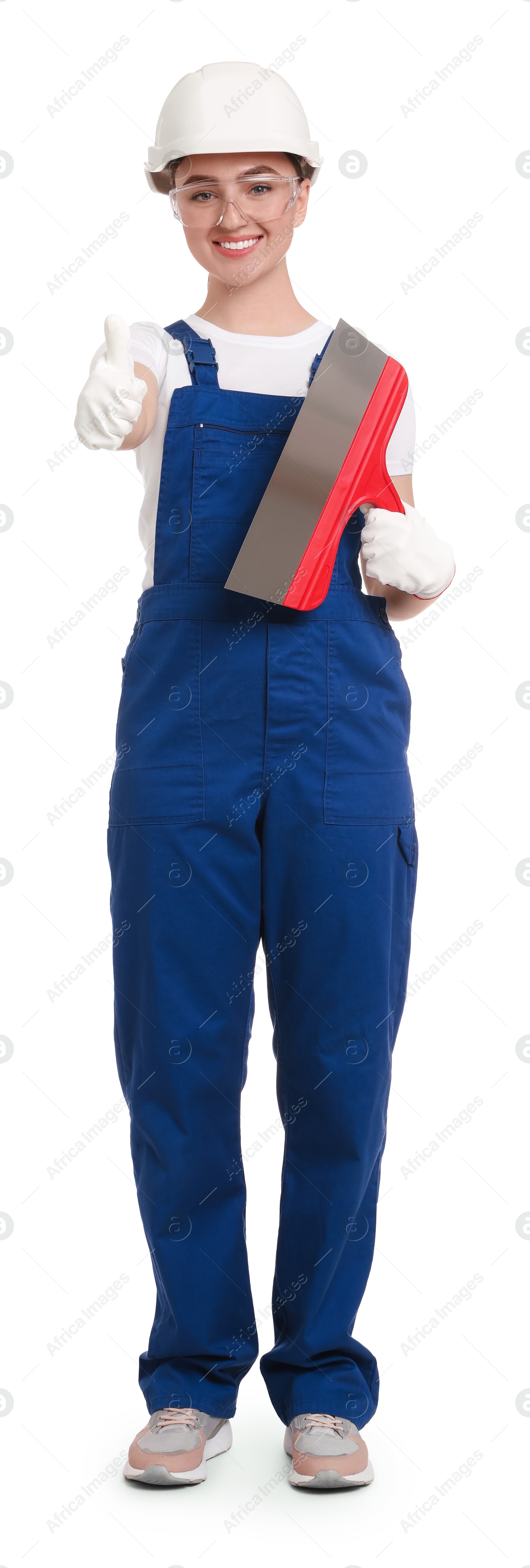 Photo of Young decorator with putty knife on white background