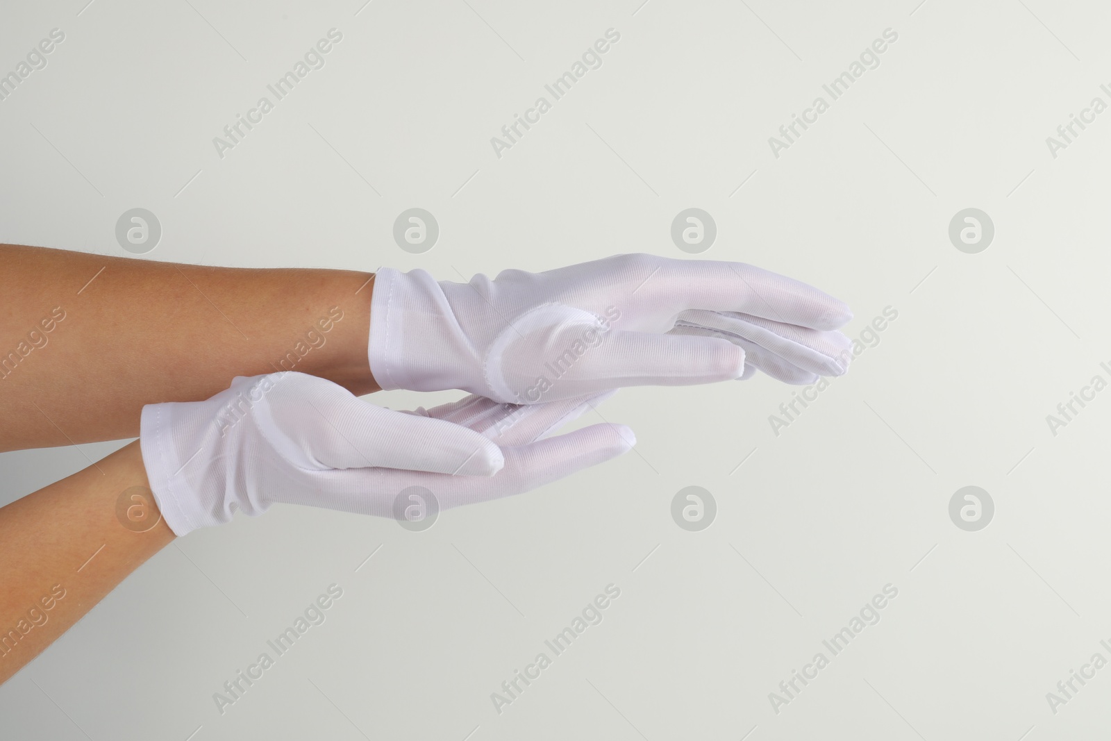 Photo of Woman in elegant gloves on white background, closeup