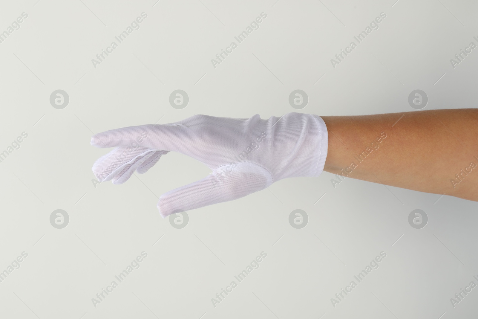 Photo of Woman in elegant glove on white background, closeup