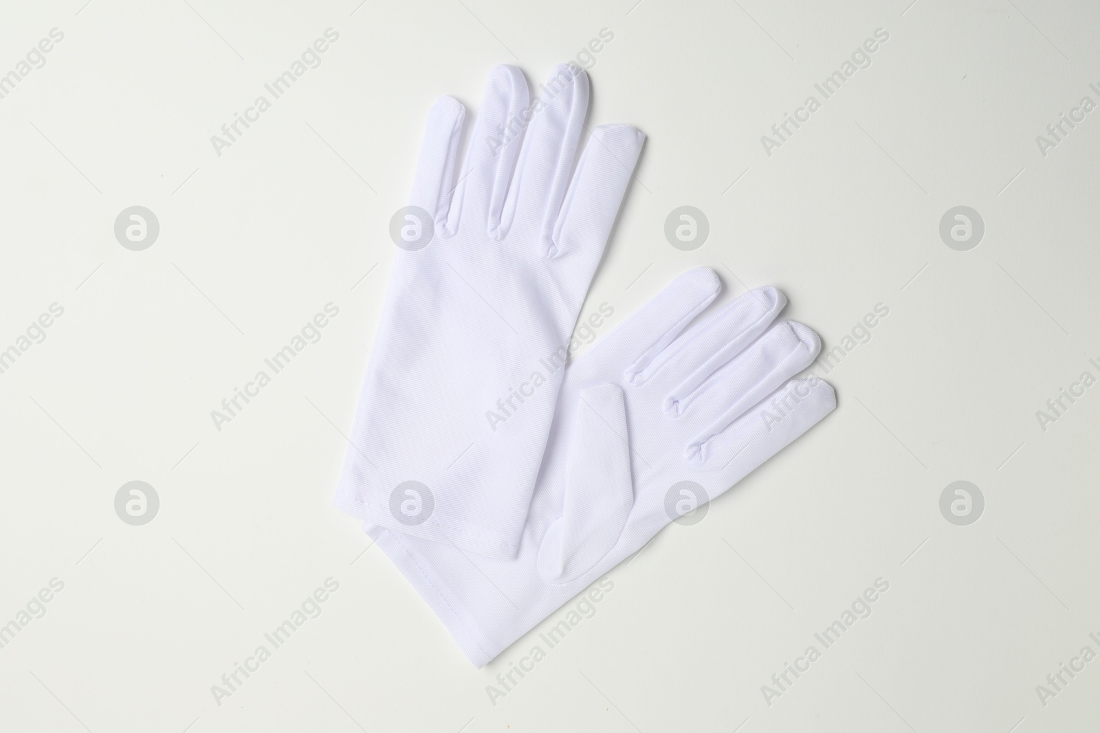 Photo of Elegant gloves on white background, top view