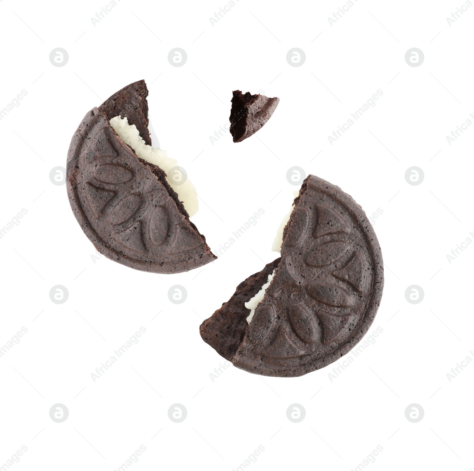 Image of Tasty broken sandwich cookie in air on white background