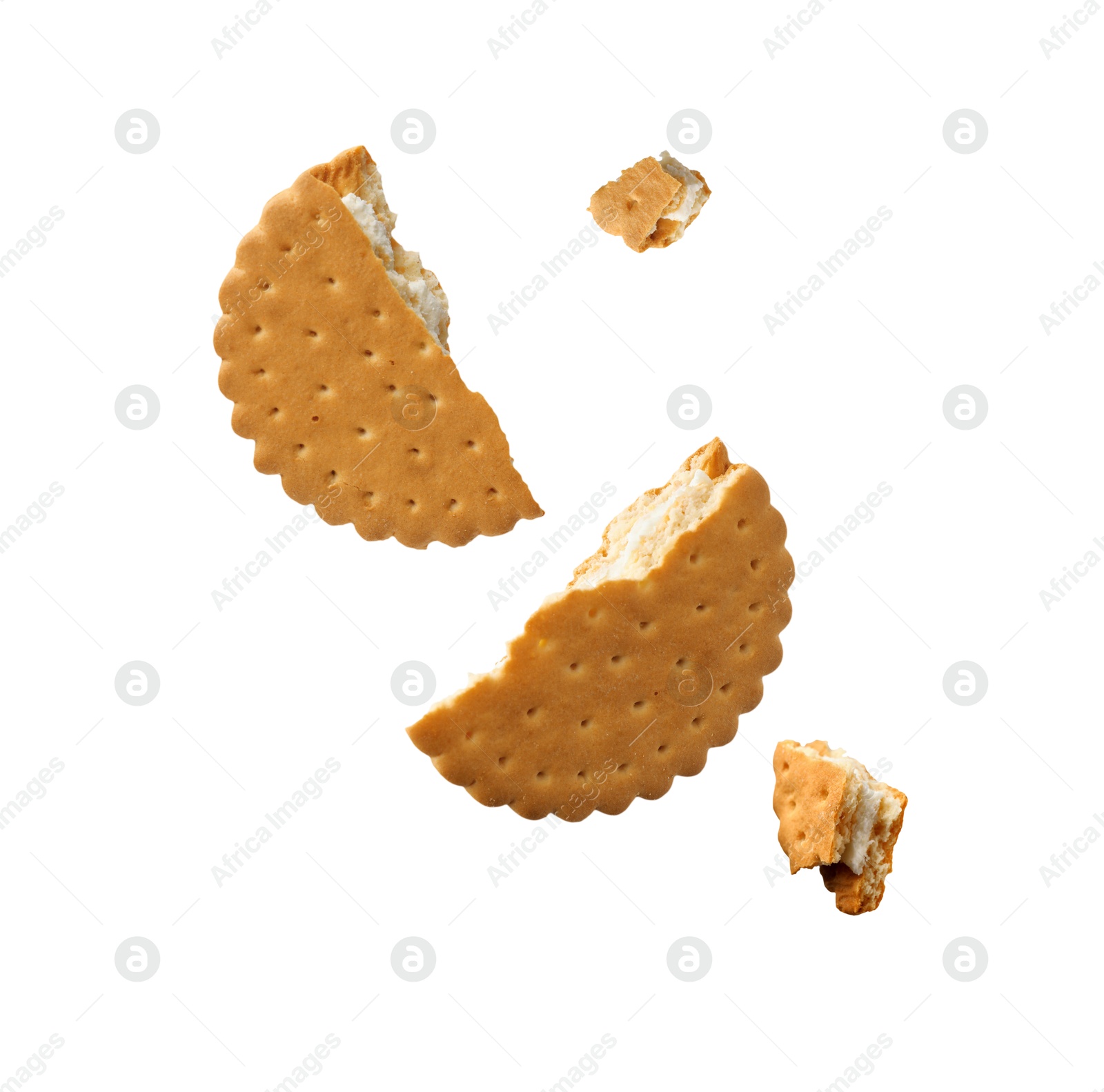 Image of Tasty broken sandwich cookie in air on white background