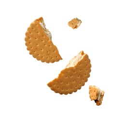 Image of Tasty broken sandwich cookie in air on white background