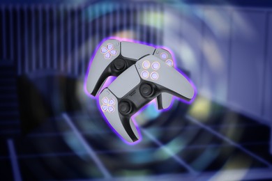 Image of Glowing game controllers, motion blur effect. Playing video game