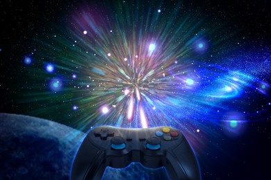 Image of Video game controller flying in cosmos. Playing space flight simulation