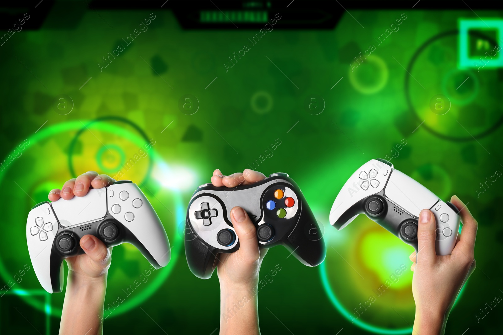 Image of Friends with joysticks playing video game, closeup