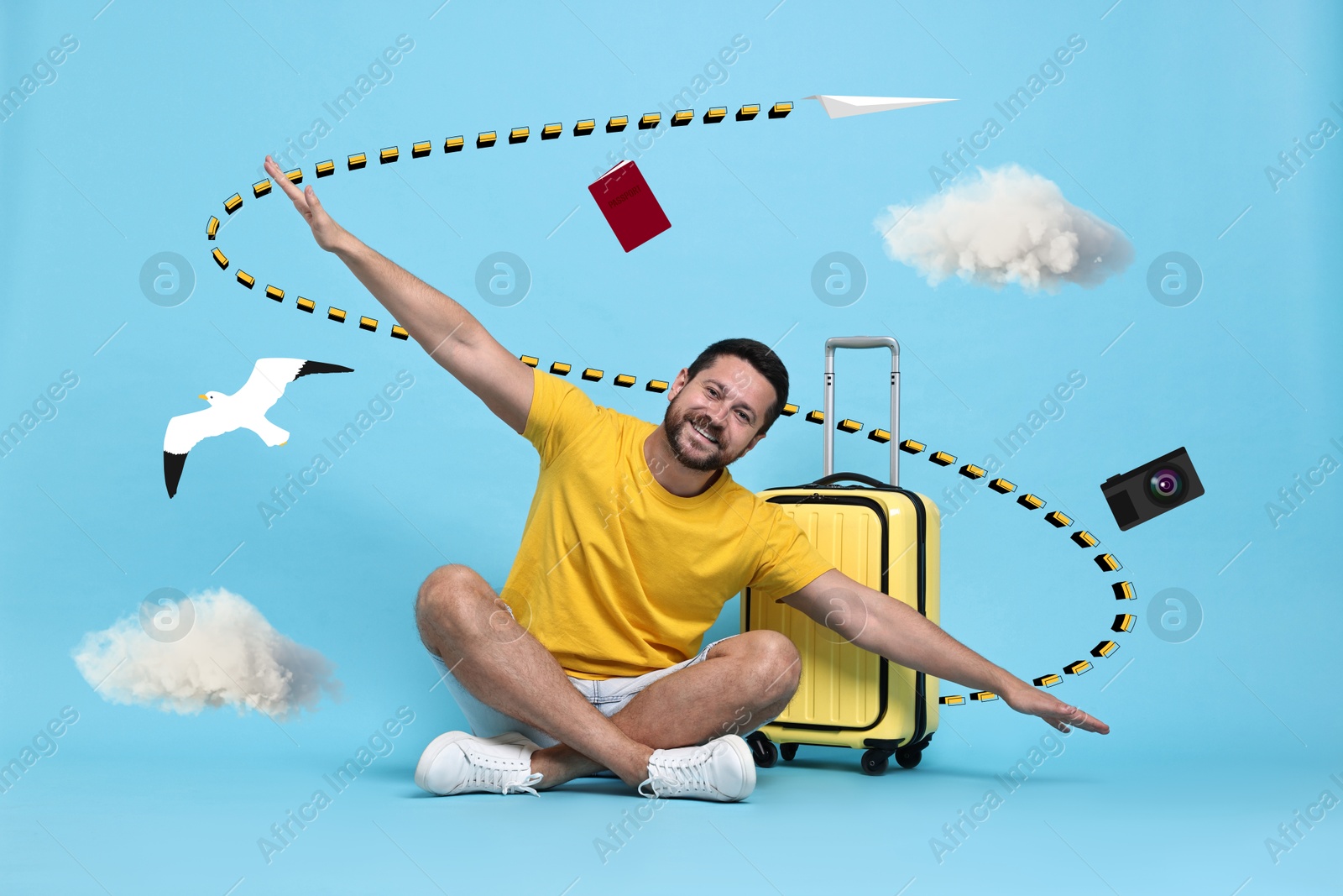 Image of Happy traveler with suitcase, spreading his hands as airplane wings on light blue background with clouds and seagull. Trace left by paper plane near him