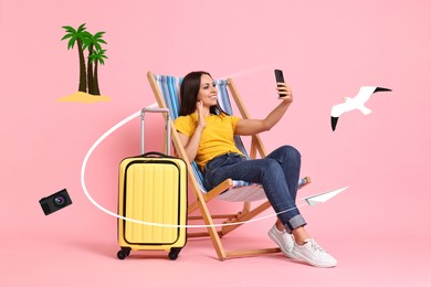 Happy traveler with suitcase having video chat via mobile phone on sunlounger against pink background. Paper plane flying and other illustrations around her