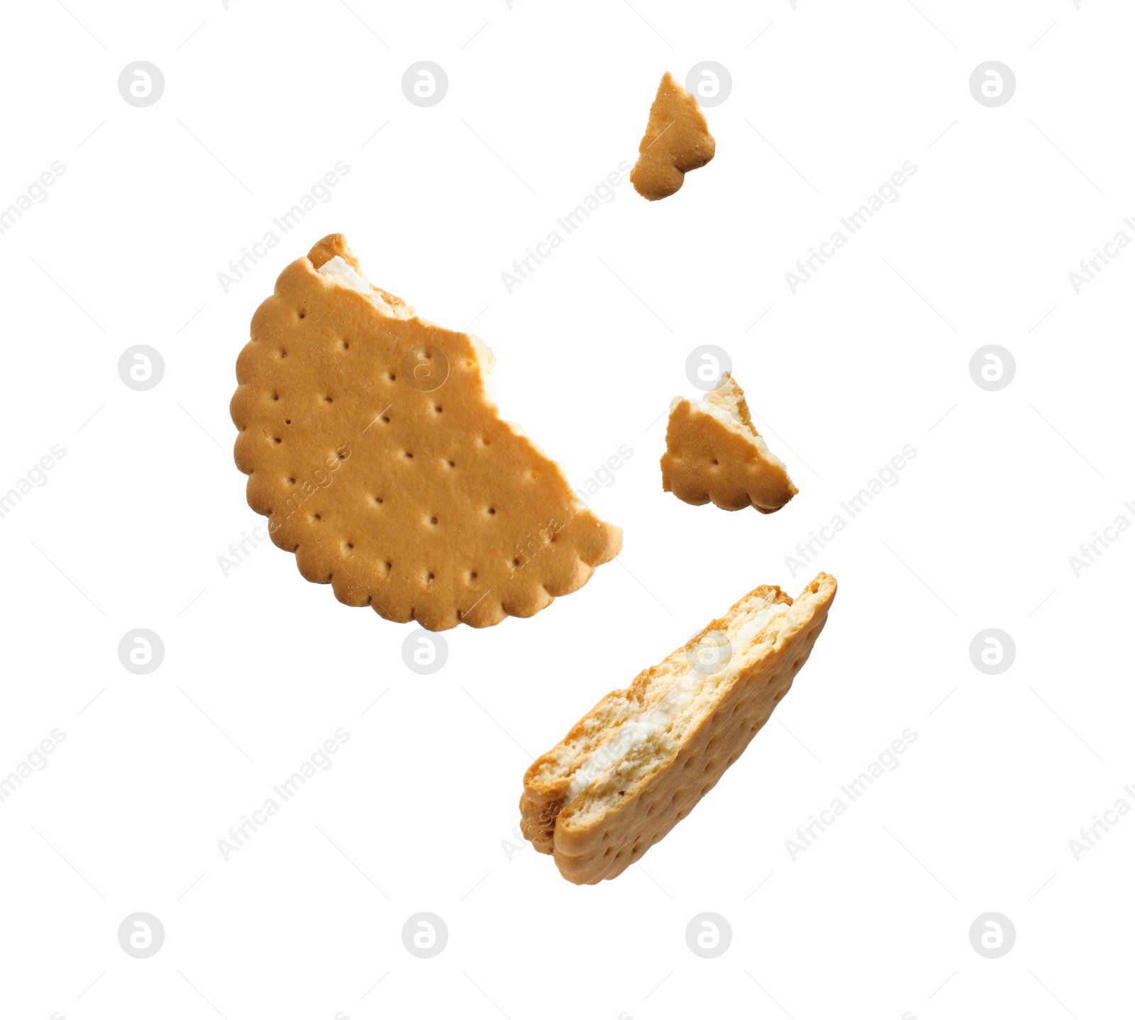 Image of Tasty broken sandwich cookie in air on white background