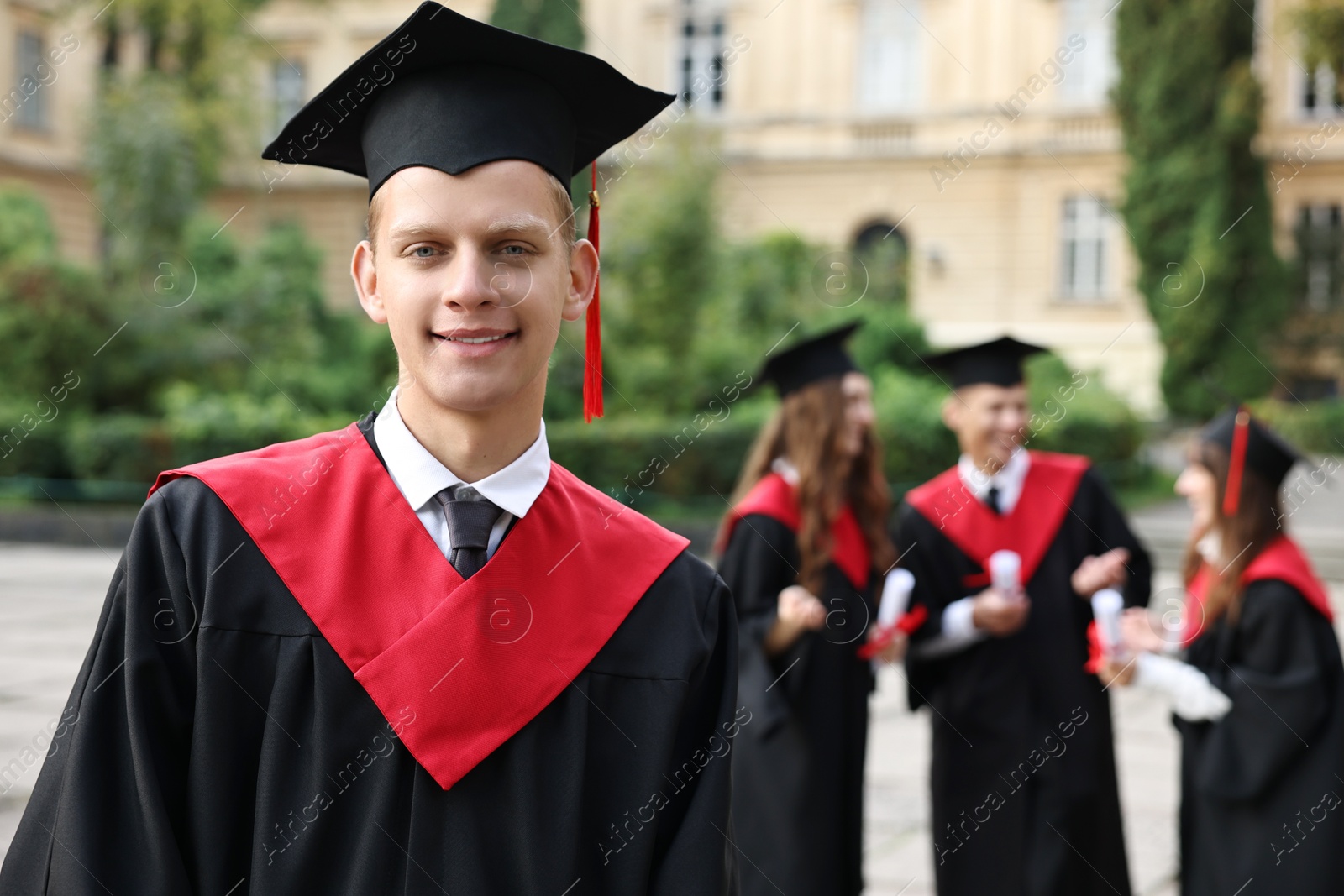 Photo of Graduation ceremony. Happy students outdoors, selective focus