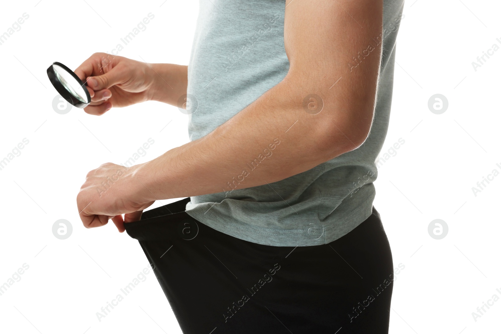 Photo of STD (sexually transmitted diseases). Man examining intimate area with magnifying glass on white background, closeup