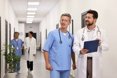 Healthcare workers with clipboard in hospital. Medical service