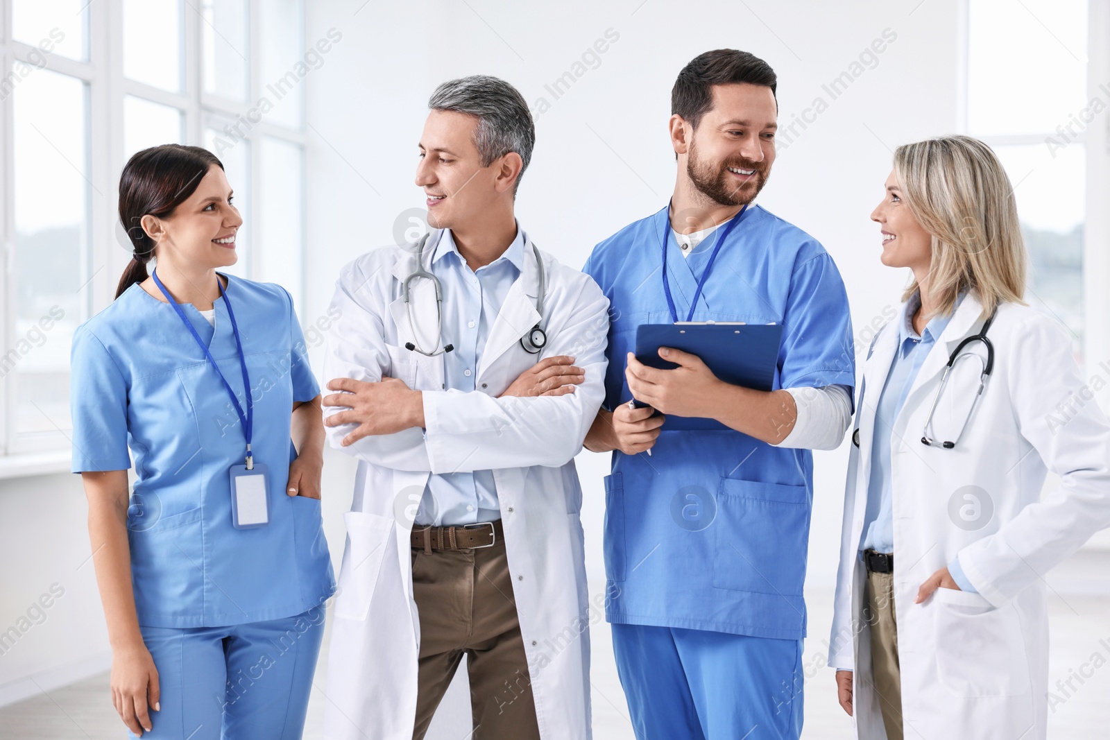 Photo of Team of smiling healthcare workers in hospital