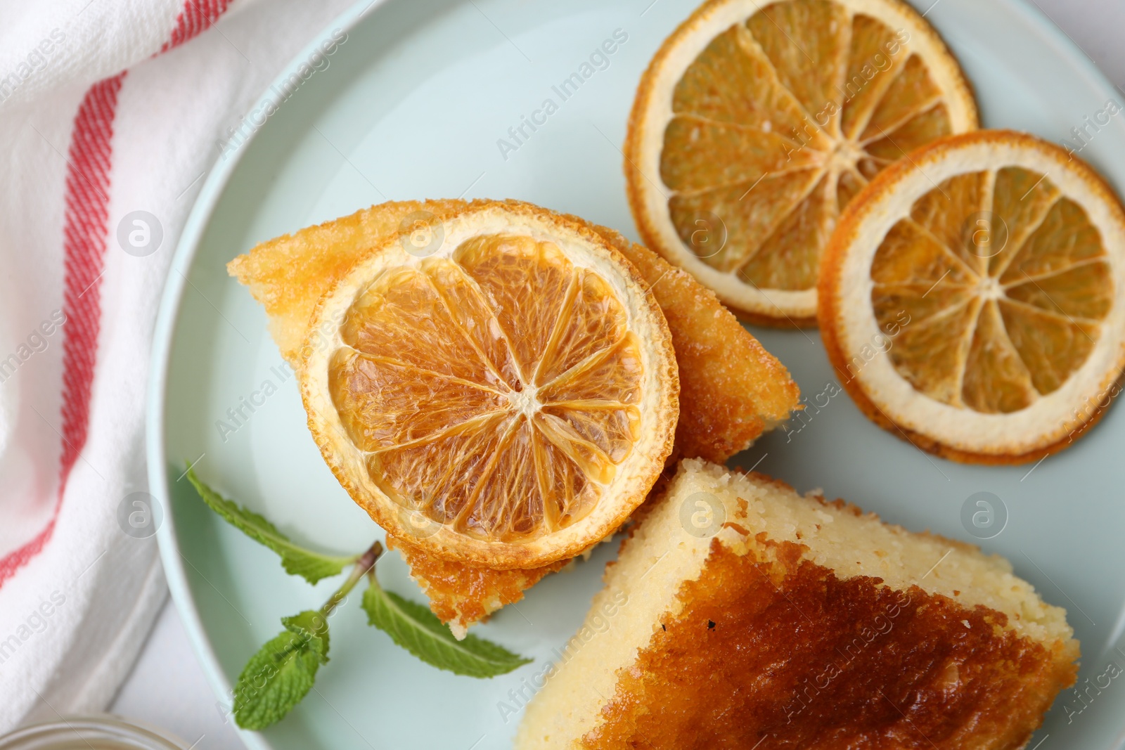 Photo of Tasty semolina cake served on table, flat lay