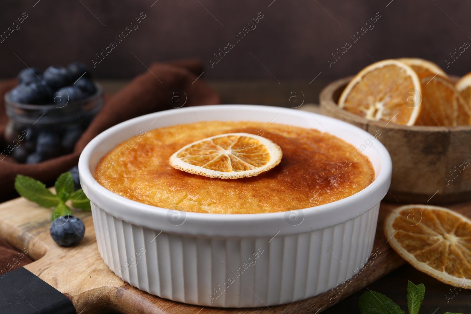 Photo of Tasty semolina cake served on wooden table, closeup