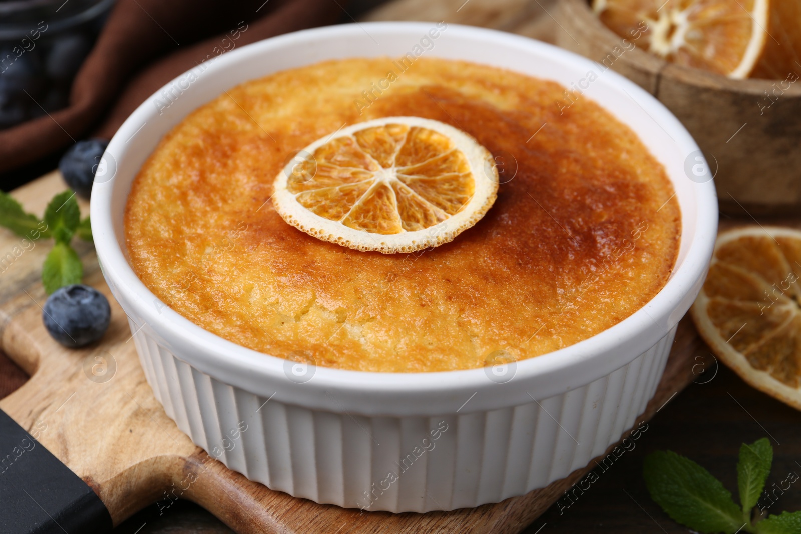 Photo of Tasty semolina cake served on wooden table, closeup