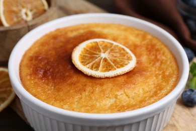 Photo of Tasty semolina cake served on wooden table, closeup