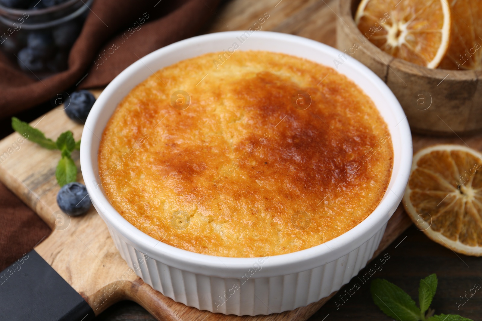 Photo of Tasty semolina cake served on wooden table, closeup