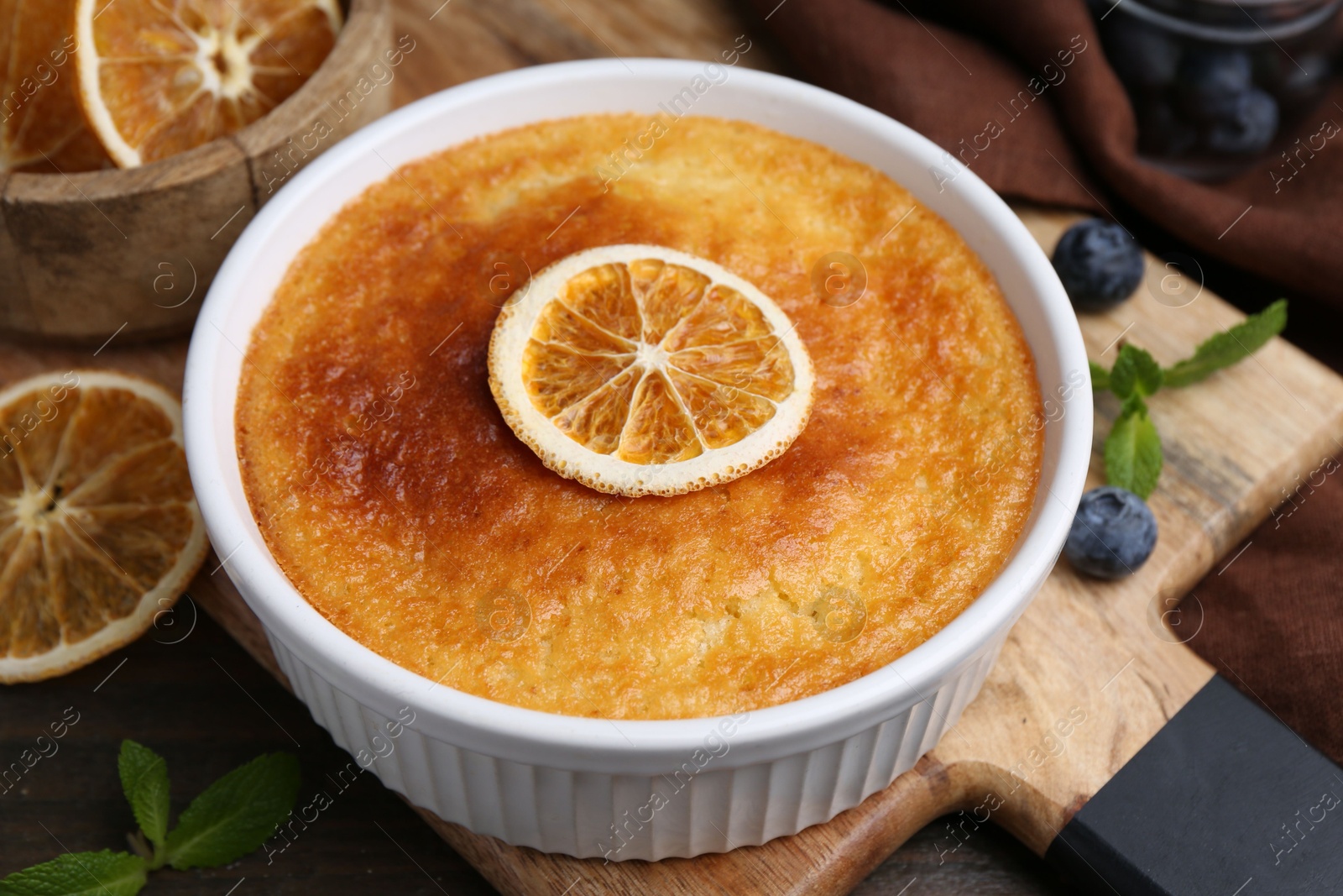 Photo of Tasty semolina cake served on wooden table, closeup