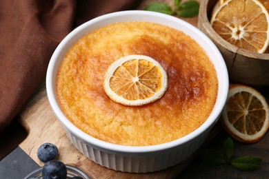 Photo of Tasty semolina cake served on wooden table, closeup