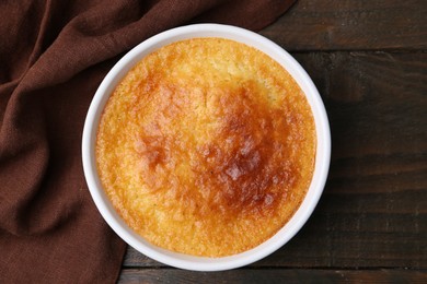 Photo of Tasty semolina cake served on wooden table, top view