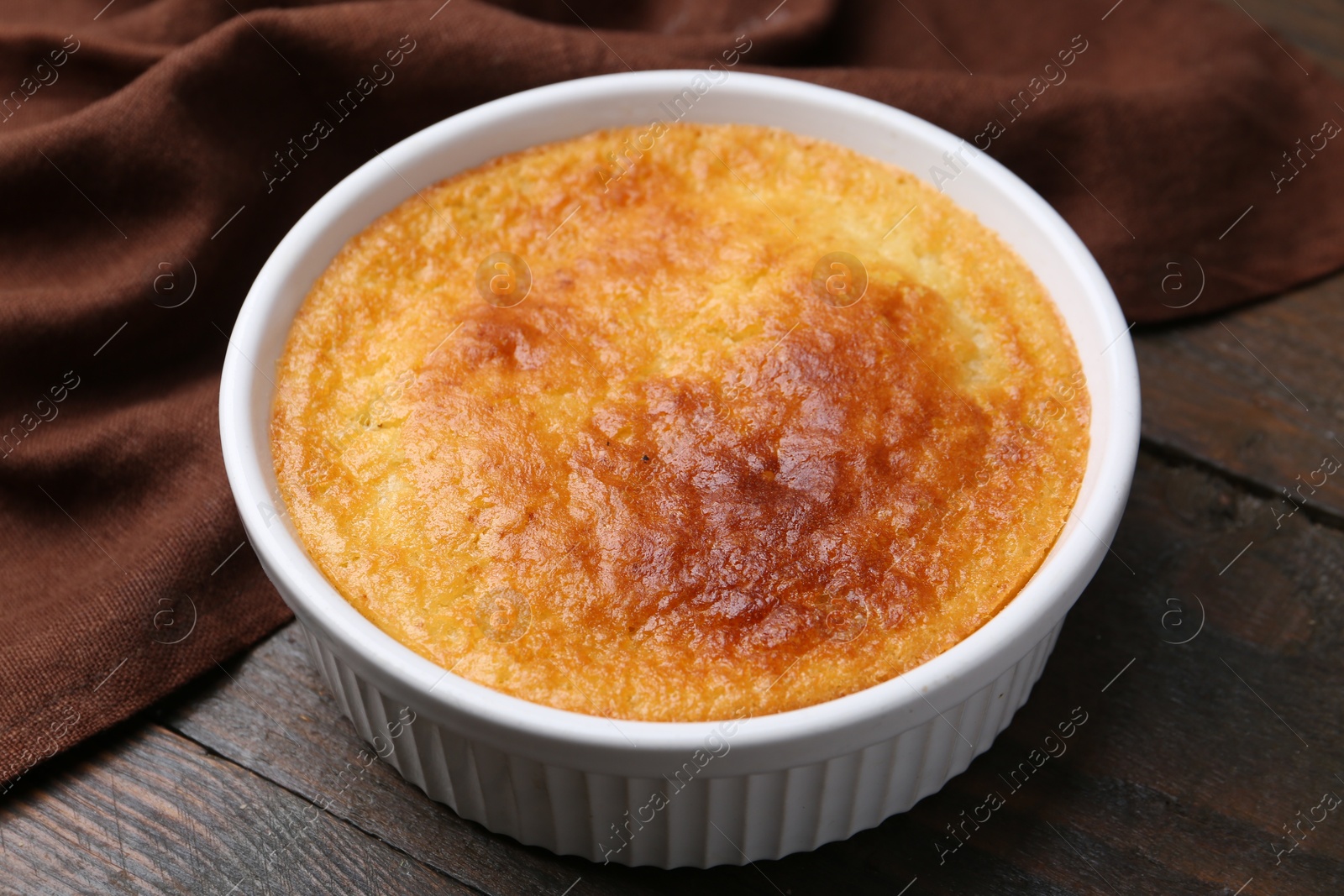 Photo of Tasty semolina cake served on wooden table, closeup