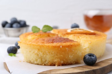 Photo of Tasty semolina cake served on table, closeup