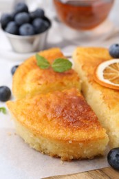 Photo of Tasty semolina cake served on table, closeup