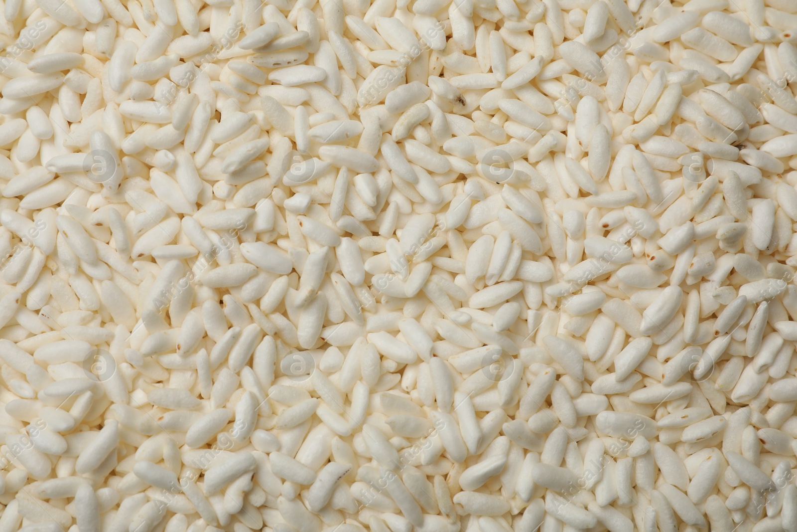 Photo of Wholegrain puffed rice as background, closeup view